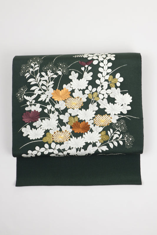 深緑色の縮緬御所解帯のお太鼓の写真