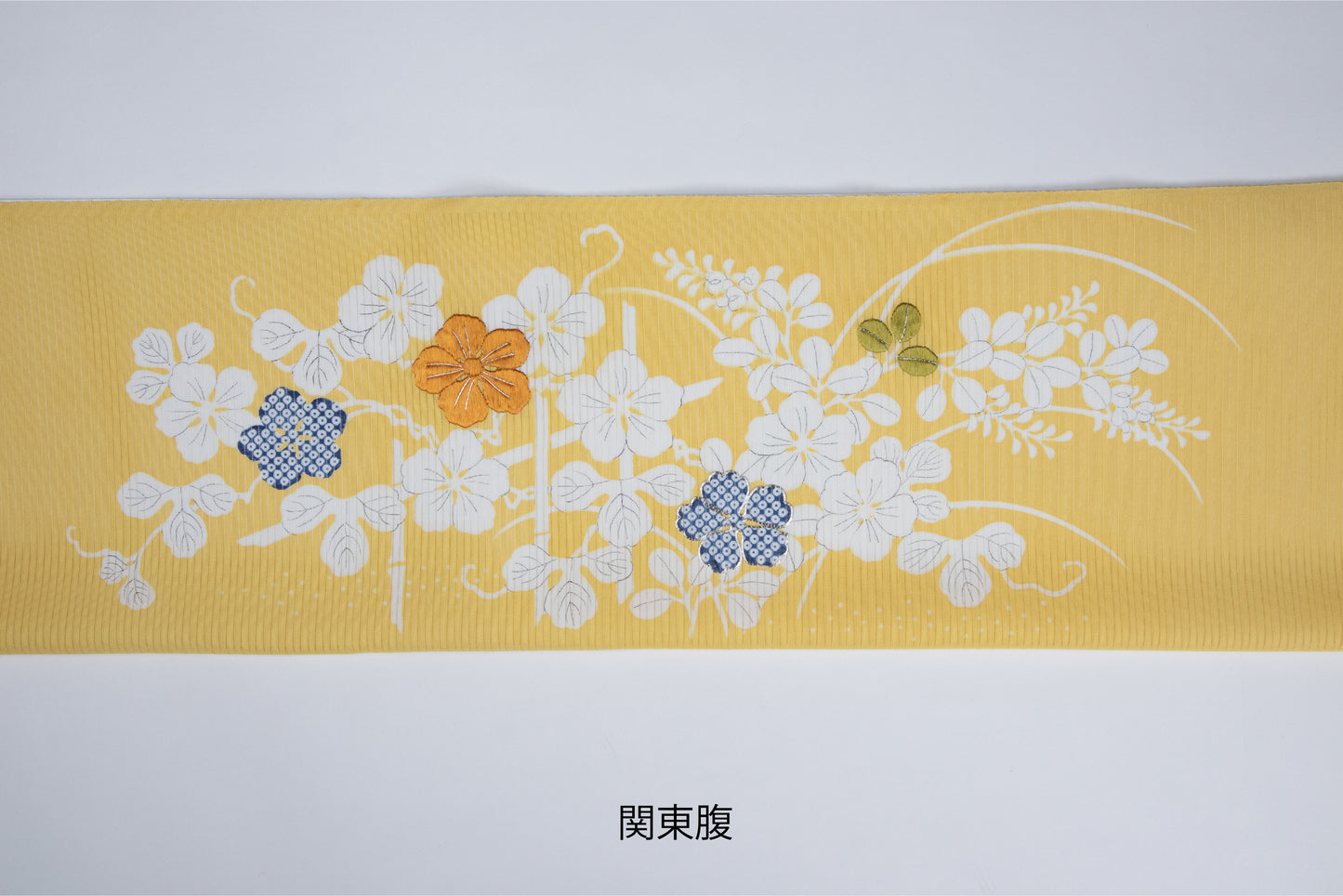 黄色の駒絽の夏御所解帯の関東腹の写真